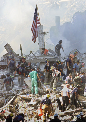 An American flag is posted in the rubble of the World Trade Center ...