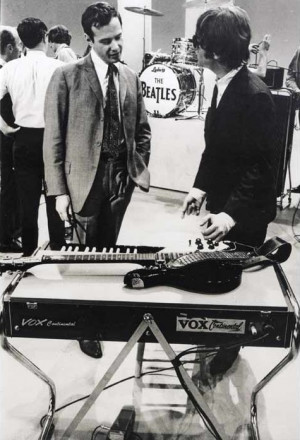 Brian Epstein chats with John during rehearsals for the group’s ...