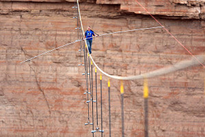 Aerialist Nik Wallenda walks a two-inch-thick steel cable taking him a ...