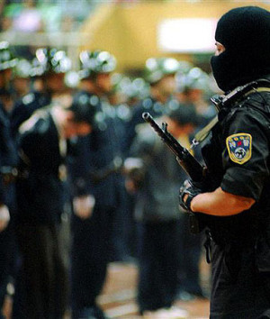 Fully-armed special task force police officers stand guard at a trial ...