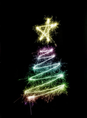 colorful christmas tree symbol drawn with sparkler trails