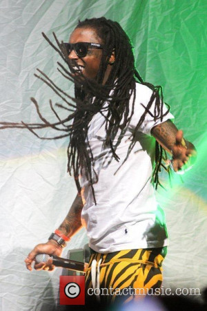 Lil Wayne loving in life on stage in 2012; maybe he is just ...