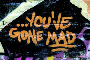 quote “you’ve gone mad” spray painted in graffiti by a graffiti ...