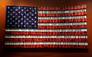flag bearing a quote about immigration by President George W. Bush ...
