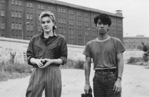 David Sylvian and Ryuichi Sakamoto in front of the Berlin Wall during ...
