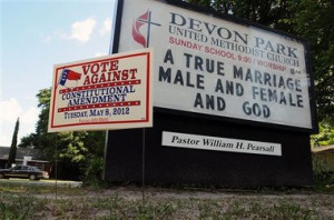 AP File Photo Signs display messages about gay marriage in front of ...