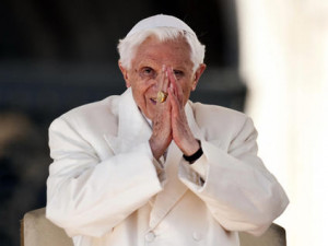 ... closes his hands in prayer at the final Audience of his pontificate