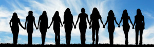 women-holding-hands-blue-background-header.jpg