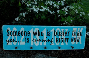 Marathon medals sign with a motivational running quote in turquoise. $ ...