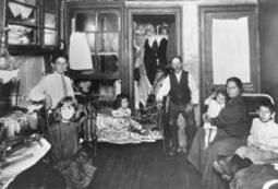 Jacob Riis photographed this poor family in their tenement apartment.