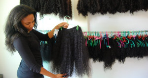 The Arunji founder Janice Wilson showing a hair extension that is ...