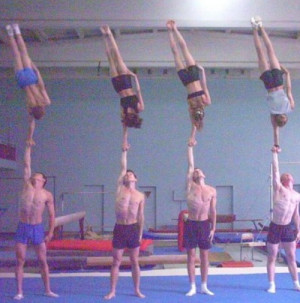 Cheerleading stunt, partner one hand.= amazinnggggg