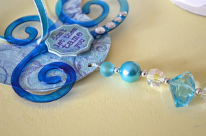 Thread Crystal Sun Catcher through bottom of bird.