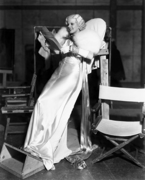 Jean Harlow propped up on a leaning board between scenes for “Dinner ...