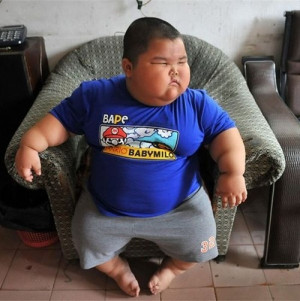 Little & funny fat boy , hee looks like an asian boy
