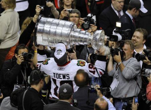 Chicago Blackhawks Jonathan Toews kisses the Stanley Cup while ...