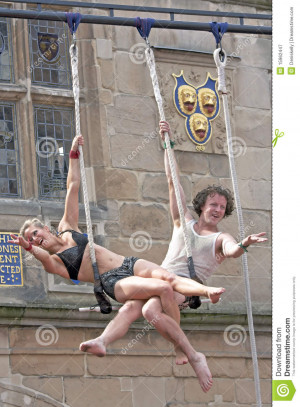 Two Circus Performers Man And Woman Perform Daring Acrobatic