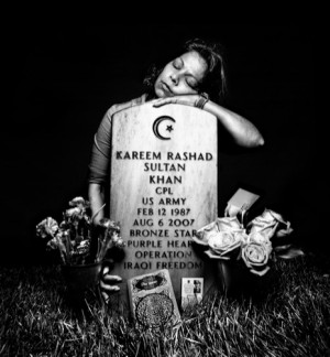 American Muslim mother at son's grave, fallen in the Iraq War