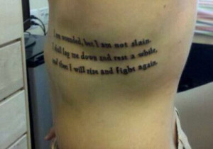 Left Rib Side Quote Tattoo For Men