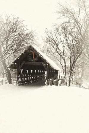 Snow in covered bridge with Christmas decorations
