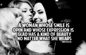woman whose smile is open and whose expression is glad has a kind of ...