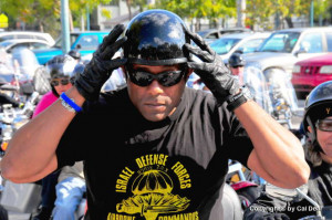 ... Rep. Allen West, a motorcycle and a flag-esque head covering