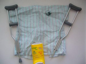 crutches hospital gown and leg cast Image