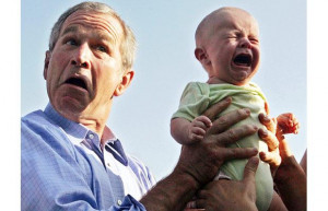 George W. Bush hands back a crying baby that was handed to him from ...