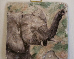 stone tile with elephant image. Cork backing and a gold hanger ...