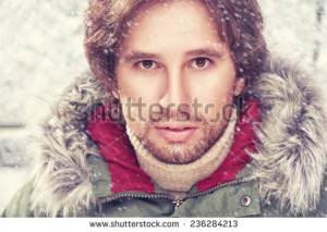 Face of a man with beard bristles, winter - stock photo