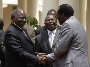 Mwai Kibaki President Mwai Kibaki L greets education ministers and
