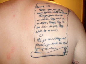 Popular style scroll tattoo created on the upper back is a testimonial ...