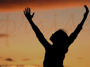 ... the worship of god and raised her hands in praise - Christian picture