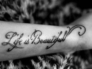 ... the beauty of life celebrated in three simple words on the lower arm