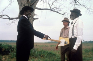 ... Willie Brown waves a gun in the motion picture Crossroads (1986