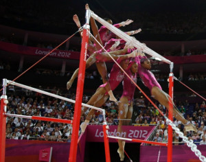 ... gymnast Gabrielle Douglas breaks it down on the uneven bars during the