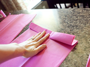 tissue paper pom poms with vinyl saying