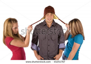 stock-photo-two-girls-fighting-over-a-boy-by-pulling-on-his-strings-on ...