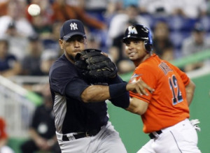 New York Yankees Rodriguez throws to first base as Miami Marlins ...