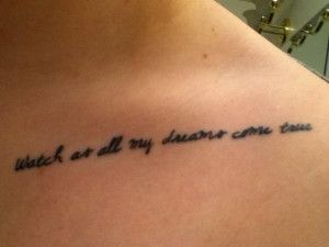 expressing lively spirit with a quote tattoo inked on collar bone