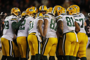 Green Bay Packers huddle before a play against the Chicago Bears ...