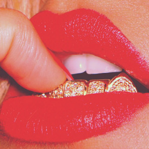 thisisntbourgeois:Red lips + red nails + gold teeth = Gorgeousness!!