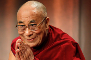 Tibet's exiled spiritual leader the Dalai Lama greets the audience as ...