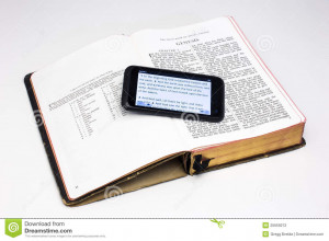 Smartphone Rests Worn Bible Both Displaying The First Verses