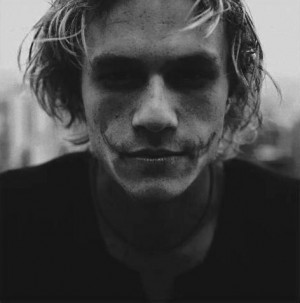 Heath Ledger wearing The Joker makeup black and white portrait