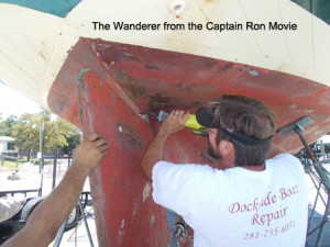 Captain Bob cutting the rudder off of the Wanderer for repair...