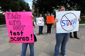 Protesters express opposition to standardized testing.