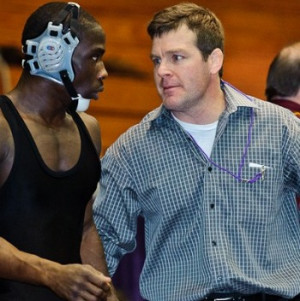 Tom Brands talks to Montell Marion at the 2011 Big Ten Championships ...