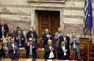 Alexis Tsipras acknowledges applause during a parliamentary session in ...