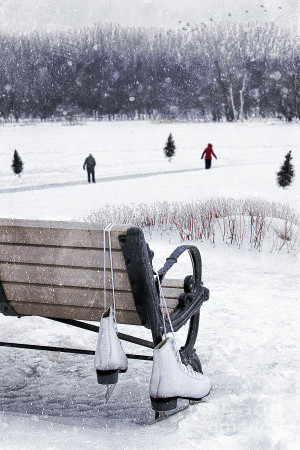 Ice Skates Hanging On Bench With People Skating In Background ...